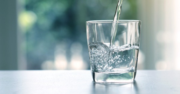 Clear water bottle on a desk